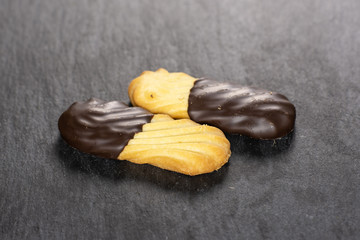 Group of two whole lazy cookie with chocolate on grey stone