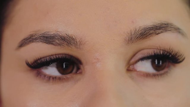 Eyebrow correction, girl's eyes before visiting the tattoo salon, closeup