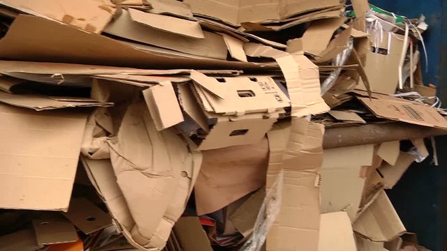 A pile of cardboard packaging ready for pressing