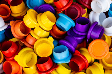 Numerous rubber caps of different colors.