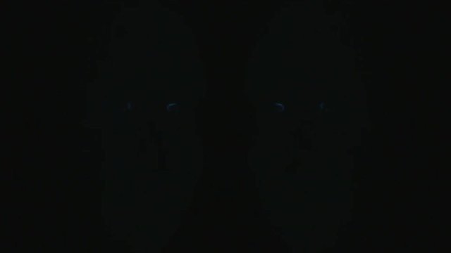 Artificial Intelligence: A 3D mesh is projected against translucent blue heads