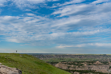 Woman Jump on Horizon Over Theodore Roosevelt National Park