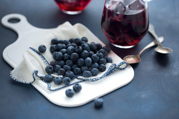 Blueberry and juice on table top.