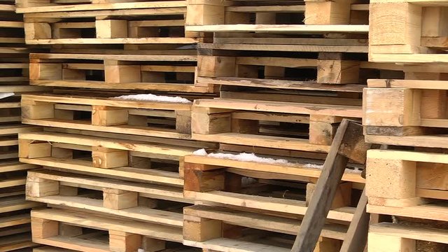 Stacks of wooden Europallets ready for use
