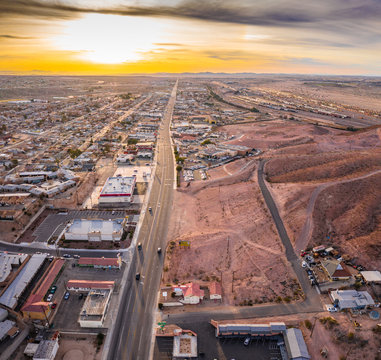 Aerial View Of Barstow Community A Residential City Of Homes And Commercial Property Community Mojave Desert California USA At Sunset