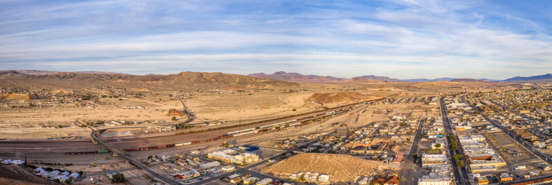 Aerial view of Barstow community a residential city of homes and commercial property community Mojave desert California USA at sunset. Railway Station and Museum