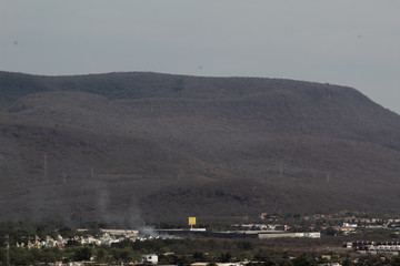 Mountain with antennas and dry trees located in the southern part of Culiacan, Sinaloa, Mexico.