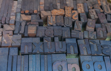 Old letterpress background, close up of many retro, random metal letters