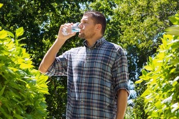 A man drinks water.