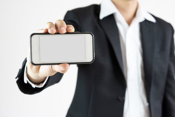 Close up of man using mobile smart phone isolated on white background.