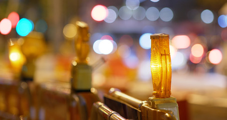 Yellow caution light in the street at night