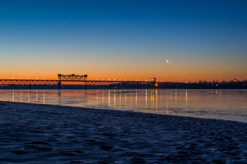 Obraz premium New moon. Beautiful river in twilight. 