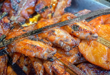 Traditional Barbeque Chicken Wings on a Stick.