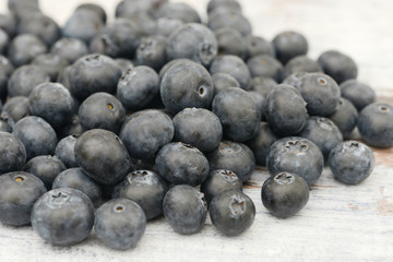 many blueberries lying on wood