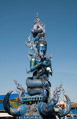 Fototapeta na wymiar Chiang Rai Thailand, giant guardian at Wat Rong Seur Ten or the Blue temple