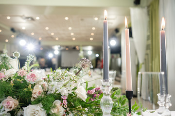 Floral decoration for wedding ceremony romance dining. Wedding banquet , festive decor. Bouquet from spring and summer flowers. Table layout. Restaurant interior. Concept of service and catering.