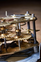 Fototapeta na wymiar metal gear mechanisms of the old clock