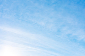 Beautiful, abstract, blue sky background. There are feathery clouds in the sky. A good place to place the text.