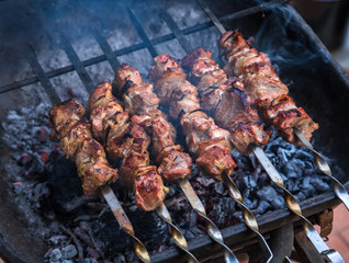 cooking grilled shish kebab on metal skewer fresh meat. cooked at barbecue bbq roasted beef meat