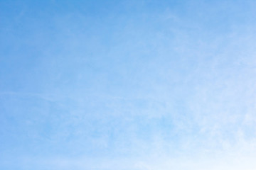 Beautiful, abstract, blue sky background. There are feathery clouds in the sky. A good place to place the text.