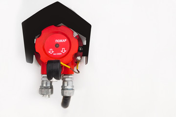 Manual pull station on the fire alarm system.  Text 