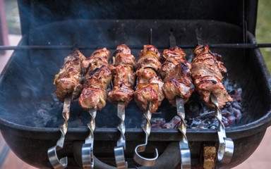 cooking grilled shish kebab on metal skewer fresh meat. cooked at barbecue bbq roasted beef meat