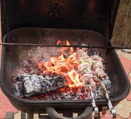 cooking grilled shish kebab on metal skewer fresh meat. cooked at barbecue bbq roasted beef meat
