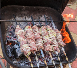 cooking grilled shish kebab on metal skewer fresh meat. cooked at barbecue bbq roasted beef meat