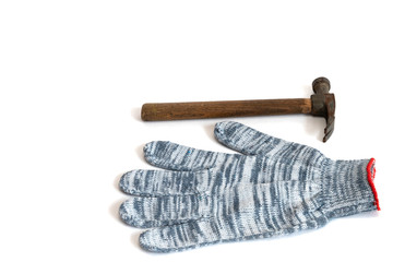 construction working gloves and hammer on white background