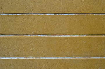 Fototapeta premium yellow wall with white lines of concrete