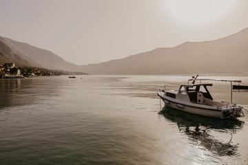 Obraz premium 30 november 2018, spectacular views of the boat in the Bay of Kotor and the city of Perast at the foot of the mountain behind - Image.