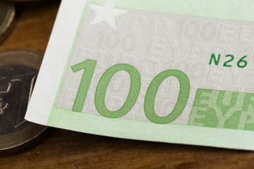 100 euro notes and coins- Image.