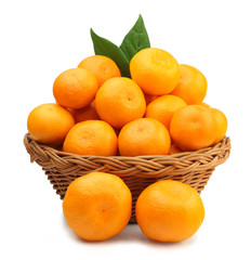 Fresh tangerines in a basket isolated on white