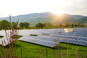 Solar panels, photovoltaics, alternative electricity source. View of a solar station at the foothills of a mountain - concept of sustainable resources