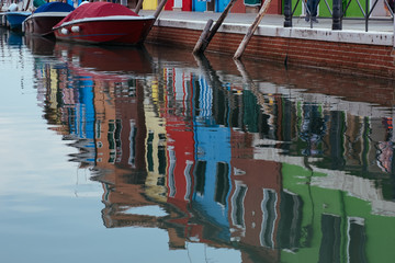 Fototapeta na wymiar Colorful geometry photo of a houses reflected in water, Burano island