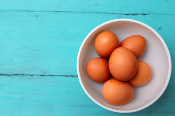 chicken eggs on wooden table
