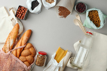 zero waste food shopping. eco natural bags and glass jar with food, eco friendly, flat lay. sustainable lifestyle concept. plastic free items. reuse, reduce, recycle, refuse. groceries in eco bags