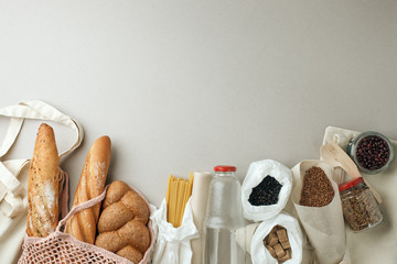 Zero waste concept, sustanable lifestyle - textile, glass and paper reusable packaging for grocery shopping, top view, flat lay, copy space, eco friendly ban plastic background