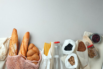 Zero waste concept, sustanable lifestyle - textile, glass and paper reusable packaging for grocery shopping, top view, flat lay, copy space, eco friendly ban plastic background