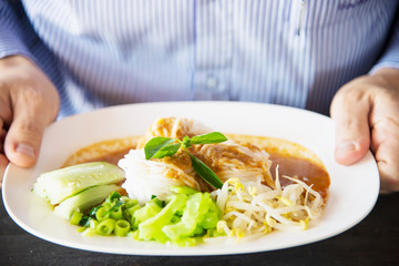 People eating spicy Northern Thai style noodle set - Thai food concept