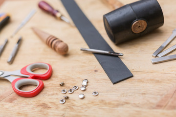 Fototapeta premium making leather belt with tools