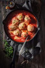 Spicy meatballs with fresh herbs and tomatoes