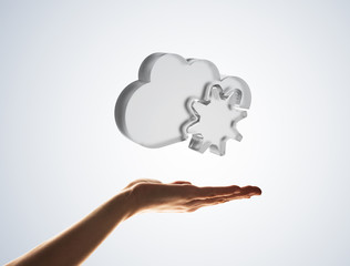 Cloud computing concept with glass symbol shown in hand
