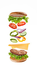  Delicious beautiful burger for a quick snack with flying ingredients.