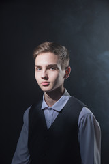 Portrait of a beautiful teenager in strict clothes with authentic appearance in vintage style