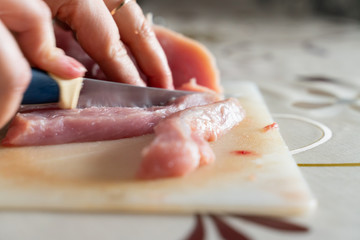 chopped meat food processing in the kitchen with knife