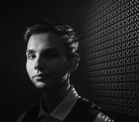 Portrait of a beautiful teenager in strict clothes with authentic appearance in vintage style