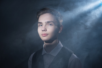 Portrait of a beautiful teenager in strict clothes with authentic appearance in vintage style