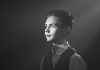 Portrait of a beautiful teenager in strict clothes with authentic appearance in vintage style