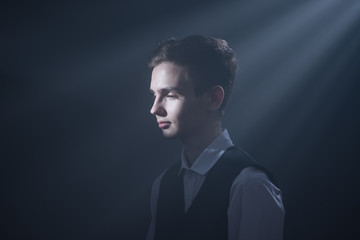 Portrait of a beautiful teenager in strict clothes with authentic appearance in vintage style